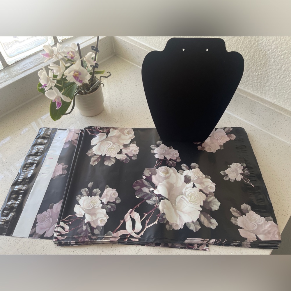 Lot: 15 10x 13 Floral Polymailers and 1 Jewelry Display 
7 3/8” W x 8 2/8” H